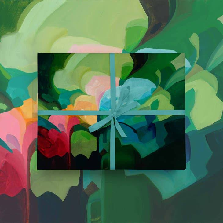 Emerald Green Gift Wrap featuring abstract floral patterns in vibrant greens, blues, and reds, tied with a teal ribbon. Ideal for artistic gift presentation.