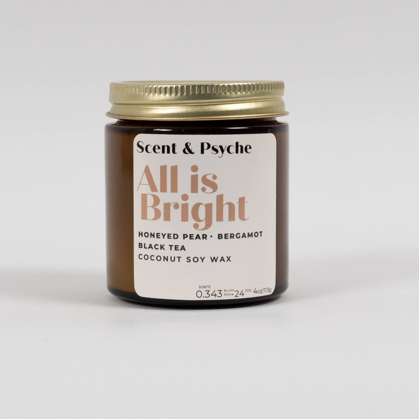 All is Bright Scented Candle in 4oz amber jar with gold lid, featuring notes of honeyed pear, bergamot, and black tea for home fragrance.