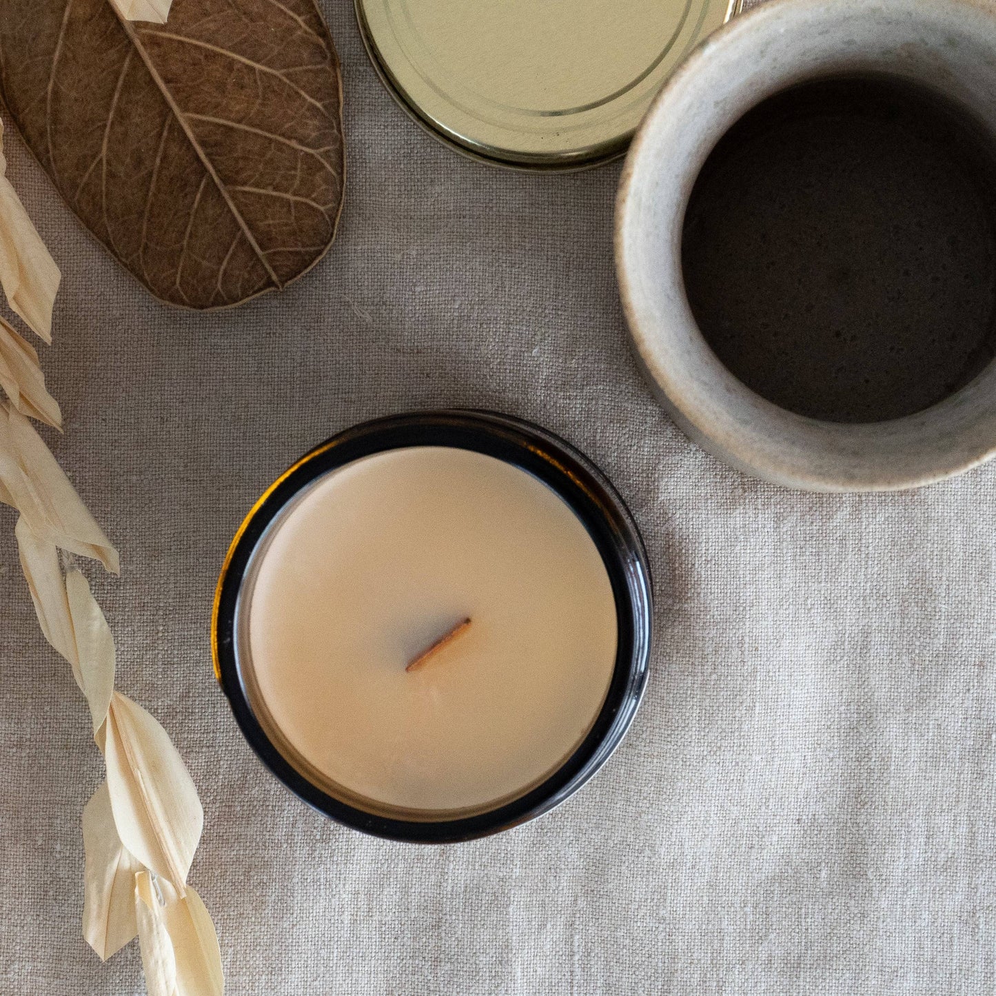 Top view of Fresh Start Wood Wick Scented Candle in a 7oz amber jar. Made with coconut soy wax for a clean and long-lasting burn.