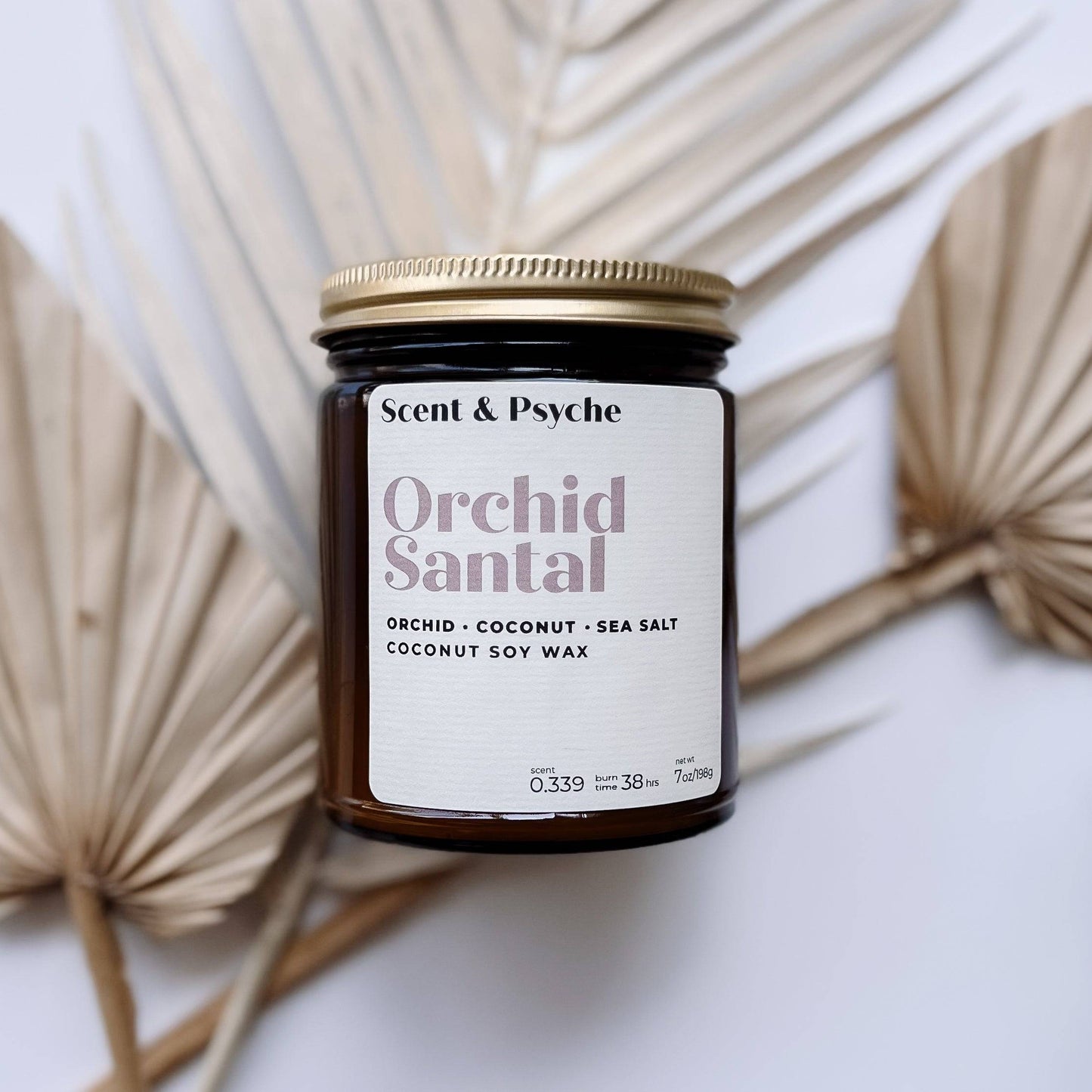 Orchid Santal Scented Candle in a 7oz amber jar with a minimalist label, featuring notes of orchid, coconut, and sea salt. Perfect for home fragrance and decor.
