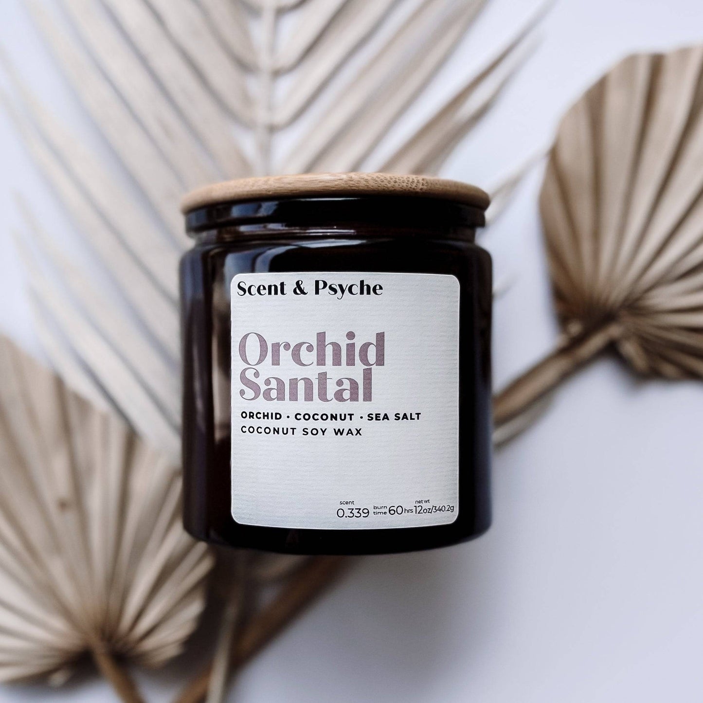 Orchid Santal Scented Candle in a 12oz amber jar with a wooden lid, featuring notes of orchid, coconut, and sea salt. Perfect for home fragrance and decor.