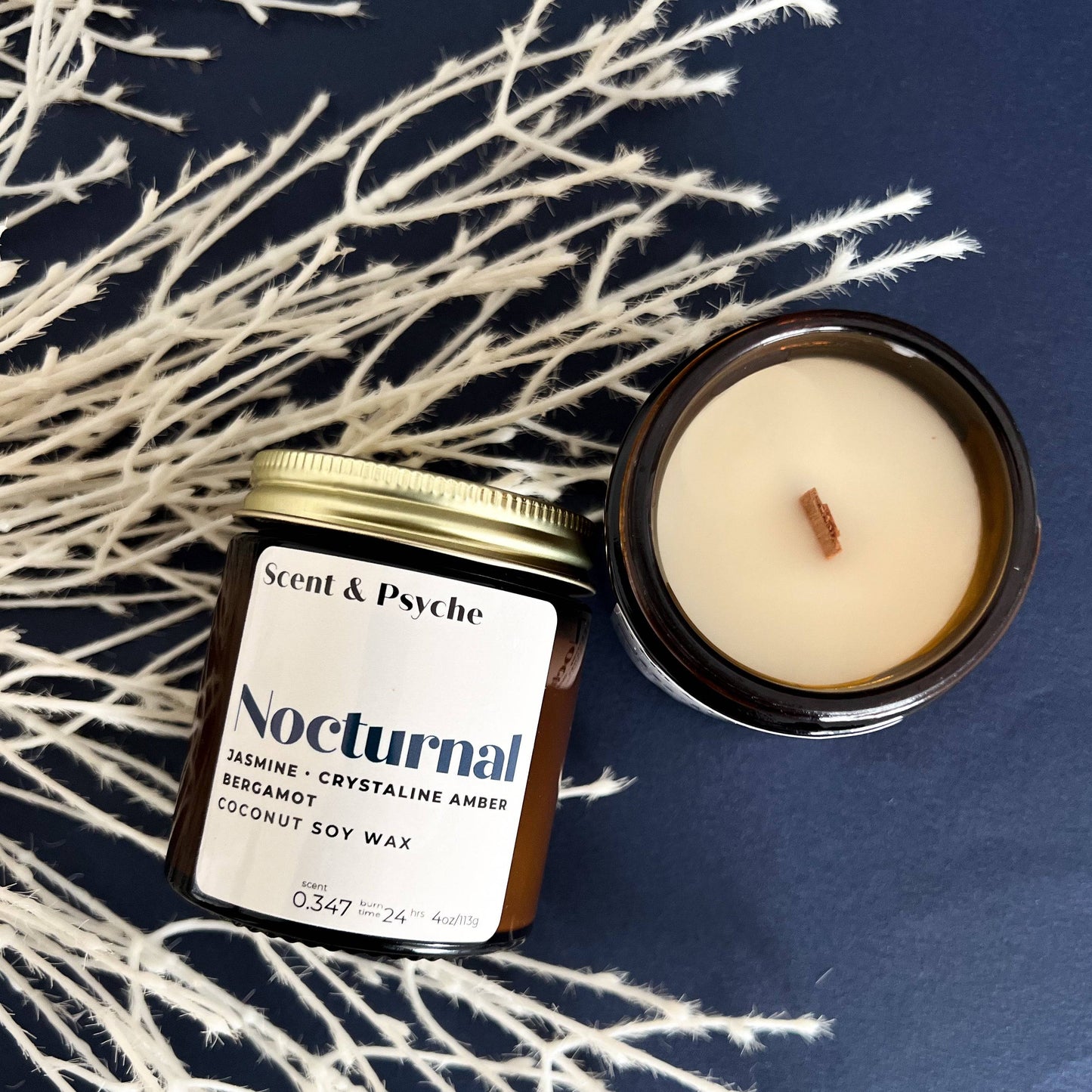 Nocturnal Wood Wick Scented Candle in a 4oz amber jar with coconut soy wax. Features jasmine, crystalline amber, and bergamot fragrance notes.