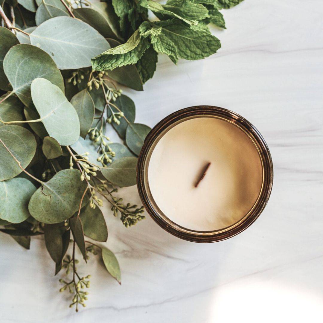 Top view of the Purist Scented Candle in a 15oz amber jar, showcasing its smooth coconut soy wax and wooden wick. A perfect home fragrance addition.