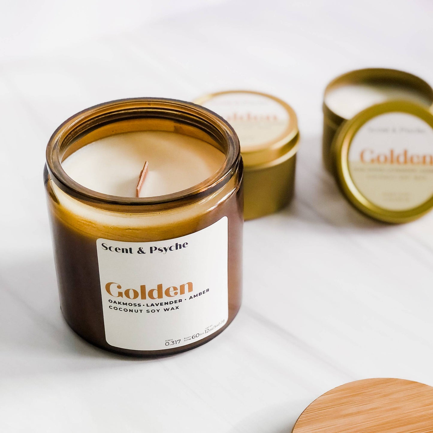 Golden Scented Candle in a 12oz amber jar with a coconut soy wax blend. Luxurious home fragrance with oakmoss, lavender, and amber notes.