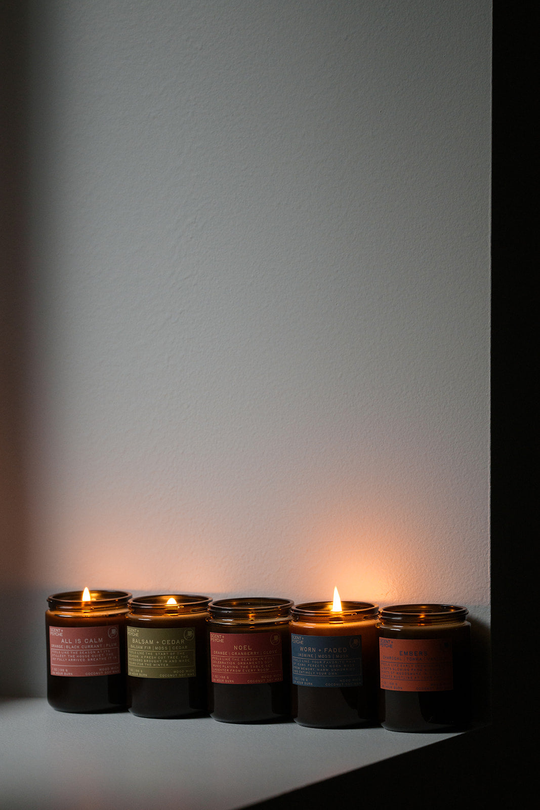 a grouping of wood wick signature size candles from Scent + Psyche