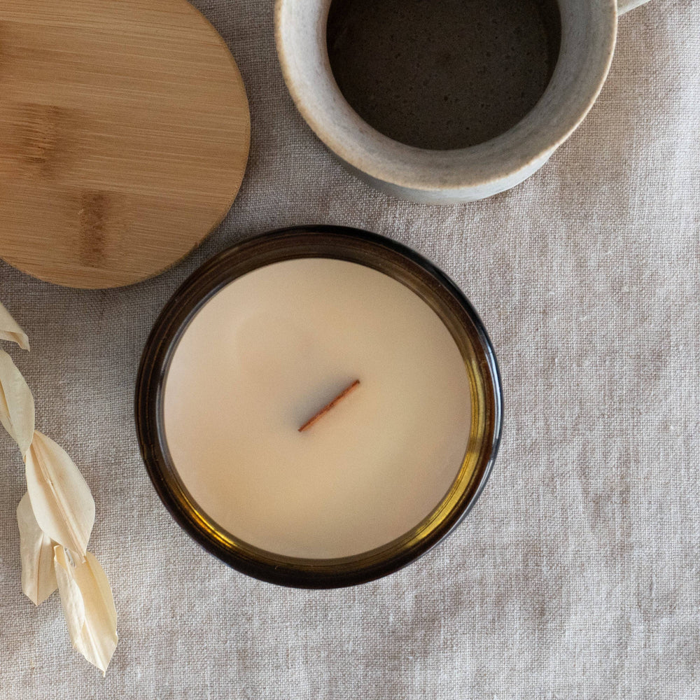 
                  
                    Top view of Fresh Start Wood Wick Scented Candle in a 12oz amber jar. Smooth coconut soy wax with a centered wooden wick for a clean burn.
                  
                