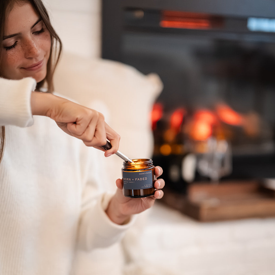 people sharing a cozy moment with Worn and Faded soy candle, soft musk and jasmine scent — Scent & Psyche