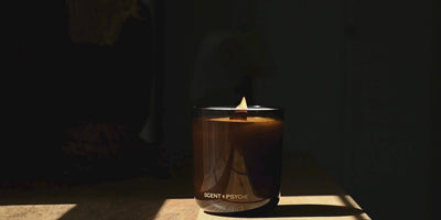 large statement size candle being blown out